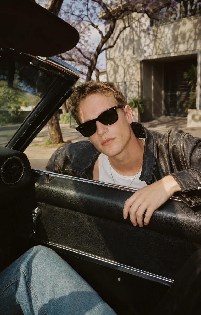Ray-Ban Wayfarer sunglasses worn in a convertible